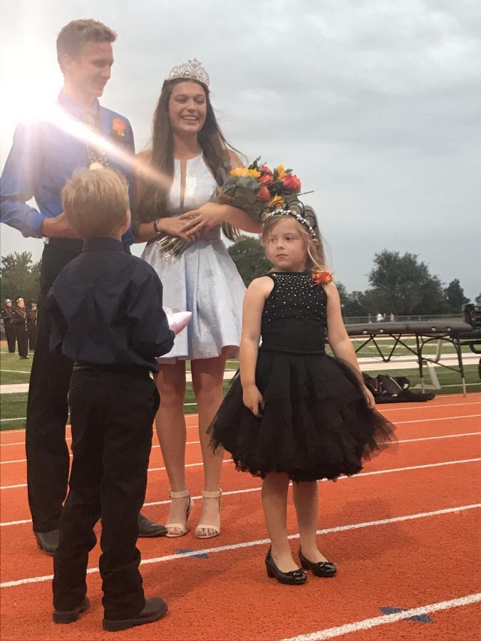 Jakob Bergkamp (12) and Sadie Williams (12) stand together after being crowned king and queen at the fall homecoming coronation. Berkgkamp said homecoming was one of the most memorable moments in his high school career.  