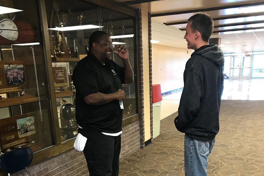 Marshal Potts (12) talks to security guard Nick Harris during lunch in the upper commons.  Harris sees part of his job as not only keeping the students safe but also supporting them.