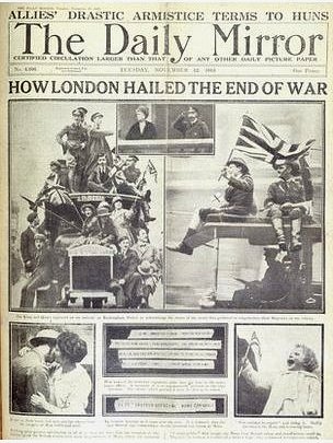 A newspaper clipping of the Daily Mirror showing images of people celebrating the end of World War I.