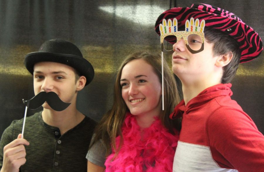 Grace Stueven (9), Payton Lewis (9), and Brendon Wedel (9) participate in the photo booth. The photos were part of The Great Kindness Challenge. 