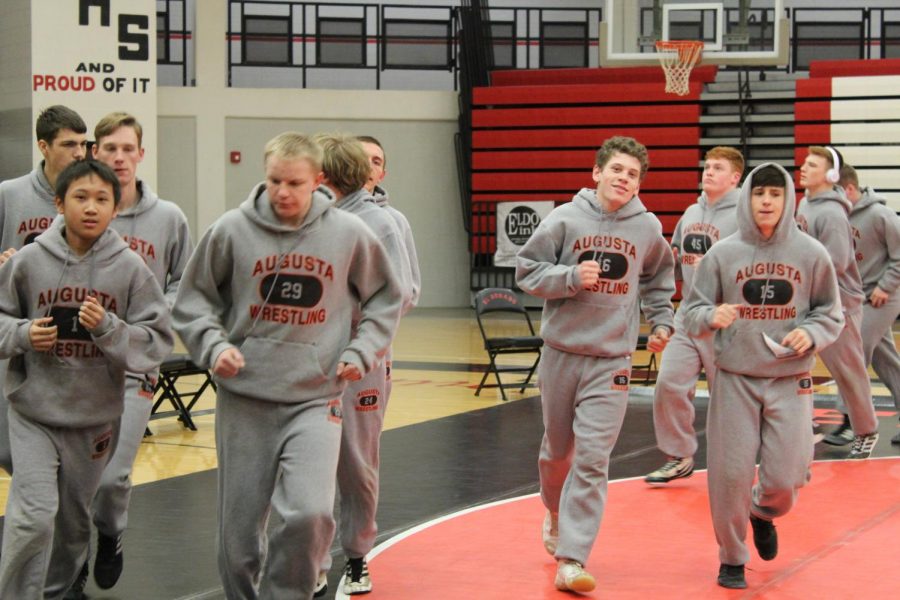 Wrestlers warm up before their dual at El Dorado Jan. 10. The Orioles went home with a win of 52 to 22.