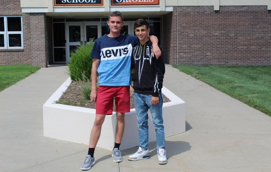 Junior Francesco Latte, from Italy, and senior Albert Kříž, from the Czech Republic, stand out side the high school. Both foreign exchange students are staying with the same host family, and they consider themselves brothers.