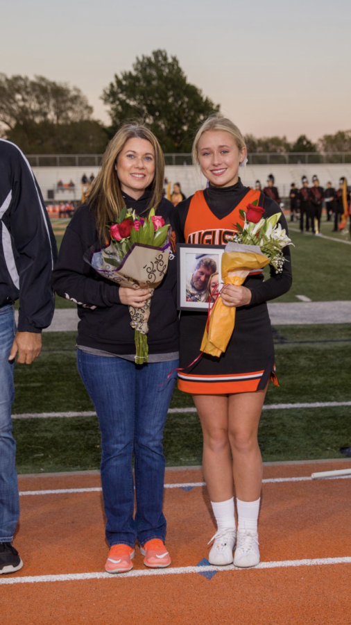 Senior+Lexi+Chinn+and+her+mom+Sherri+Combs+celebrate+senior+night+Oct.+18.+Chinn+carried+a+photo+of+her+dad+who+passed+earlier+this+year.+
