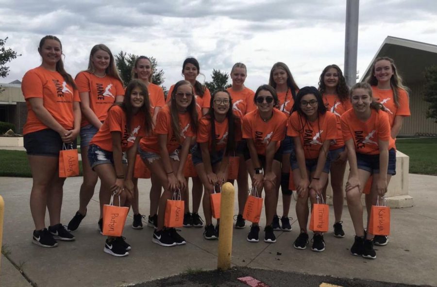 The Dance team poses in front of the high school before departing for their summer camp in Emporia. Senior Maddie Ray, junior Alexis Semisch, sophomore Trinity Tisdale, freshmen Lana Wood, and Aaralynn Chavana were nominated for the All-American dance team