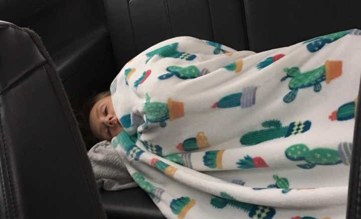 Sophomore Maddie Smart peacefully sleeps on her way home from the 2018 Game day Spirit Showcase. The cheer squad was required to wake up early for their long day at the state competition.