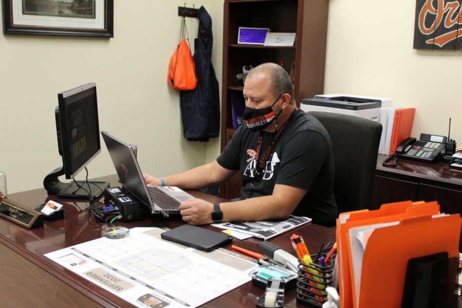 Principal Rick Rivera works at his desk after school. Multiple changes had been introduced during the start of the 2020-2021 school year.