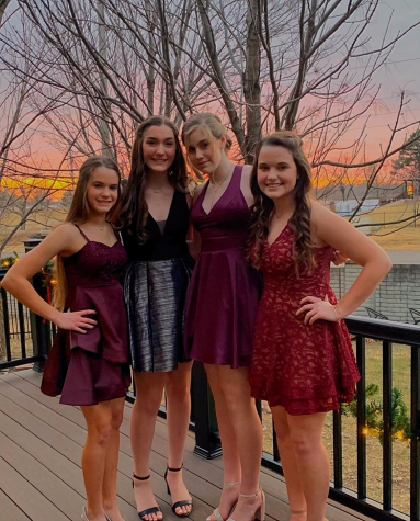 Juniors Aspen Peterson, Avery Williams, Gracie Dalzel and Morgan Curry pose for a picture outside before Jingle Bell Ball their sophomore year. “Getting dressed up and taking pictures is my favorite part of JBB, I feel bad that the senior girls will not get to experience this, this year,” Williams said. 