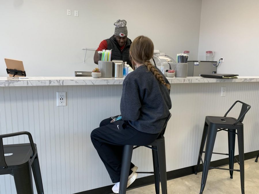 Junior Bailey Bohon waits for her meal replacement shake to be made at “At The Park Nutrition & Energy.” The shop’s grand opening was Saturday, Nov. 7, and the owners had giveaways and raffles all throughout the day.