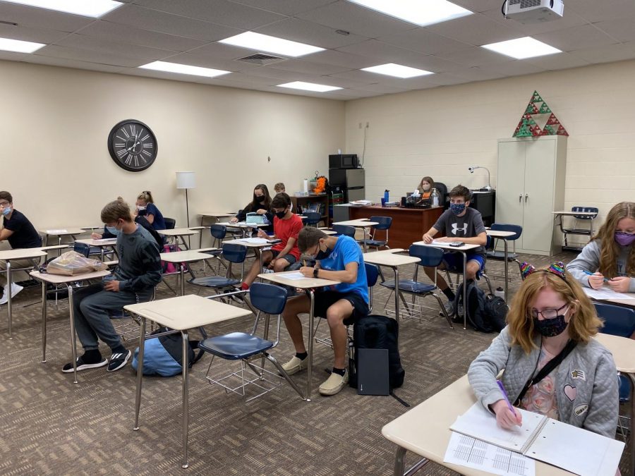Students work on homework in math teachers Summer Huber’s Algebra II class. As of last week, teachers were required to Zoom or have video instructions for their quarantined students.