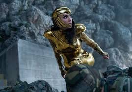 Wonder Woman (Gal Gadot) wears her golden armor, which was created by Pallas Athena and was given to Diana years later.Wonder Woman fights cheetah outside the TV station trying to stop Lord plan for wish granting.
