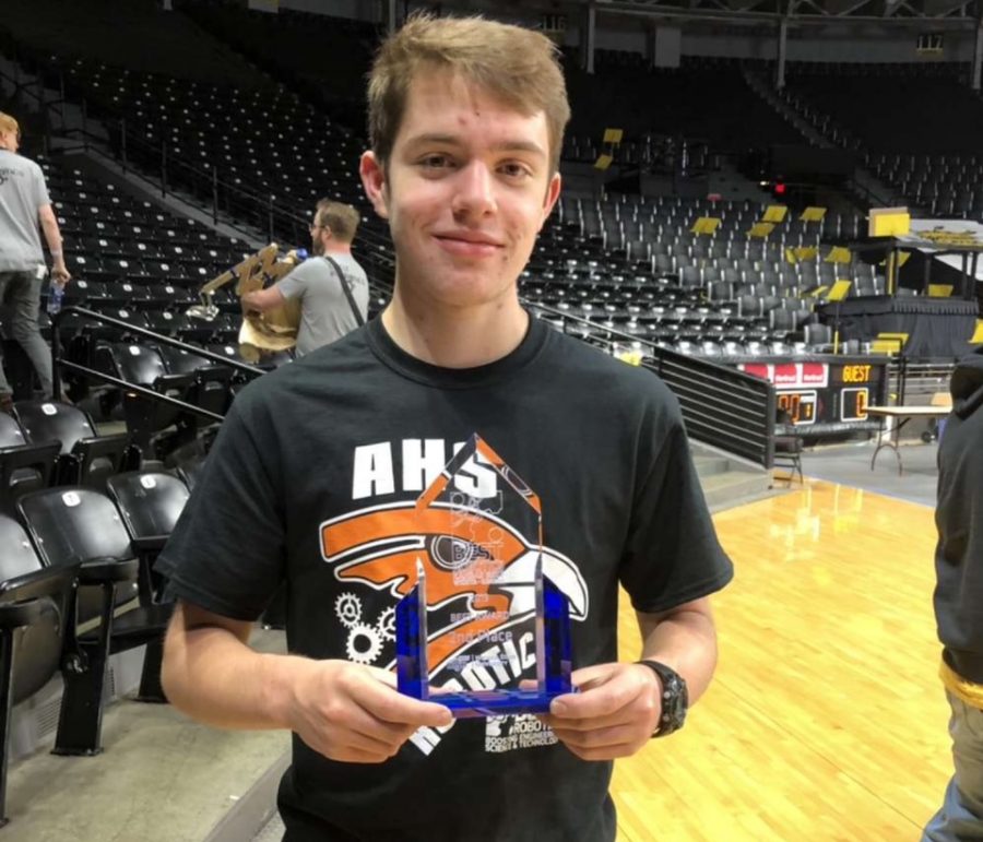 Senior Forrest Tushoff holds his second place award for the B.E.S.T. Robotics regionals. The competition was held at Wichita State University.
