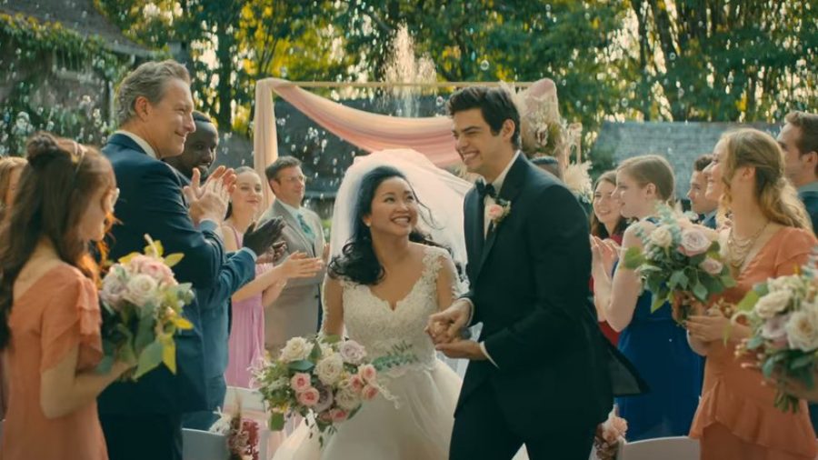 Lara+Jean+and+Peter+Kavinsky+happily+walk+down+the+aisle+on+their+wedding+day.+Lara+Jean+dreamt+of+the+day+the+two+got+married+after+going+to+college+together%2C+but+it+never+actually+happened+in+the+movie.
