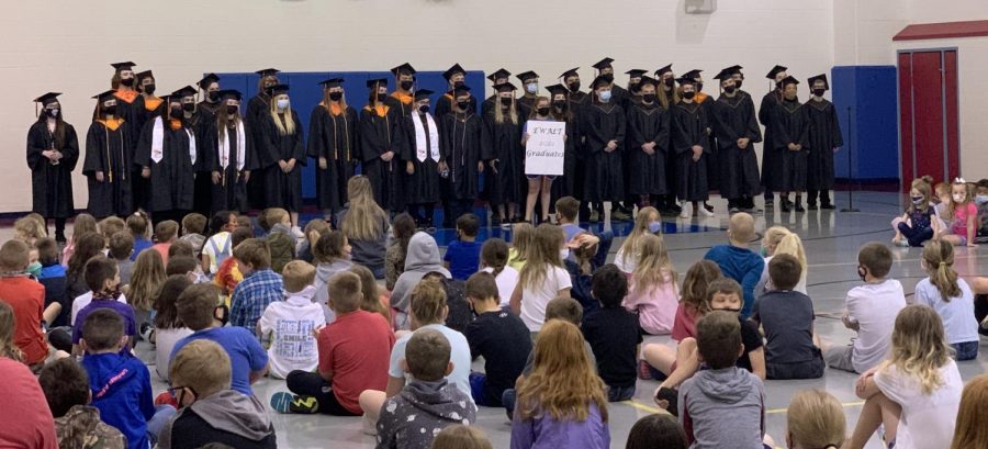 Part of the graduating senior class visits Ewalt elementary where they used to attend. The seniors walked through the building and waved to the students in class. 