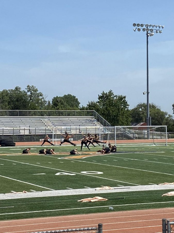 The dance team performs their routine at the pep assembly on the first day of school. As the thermometer hit almost 110 degrees this past Thursday afternoon, excited students filled the stands to watch the performance. 