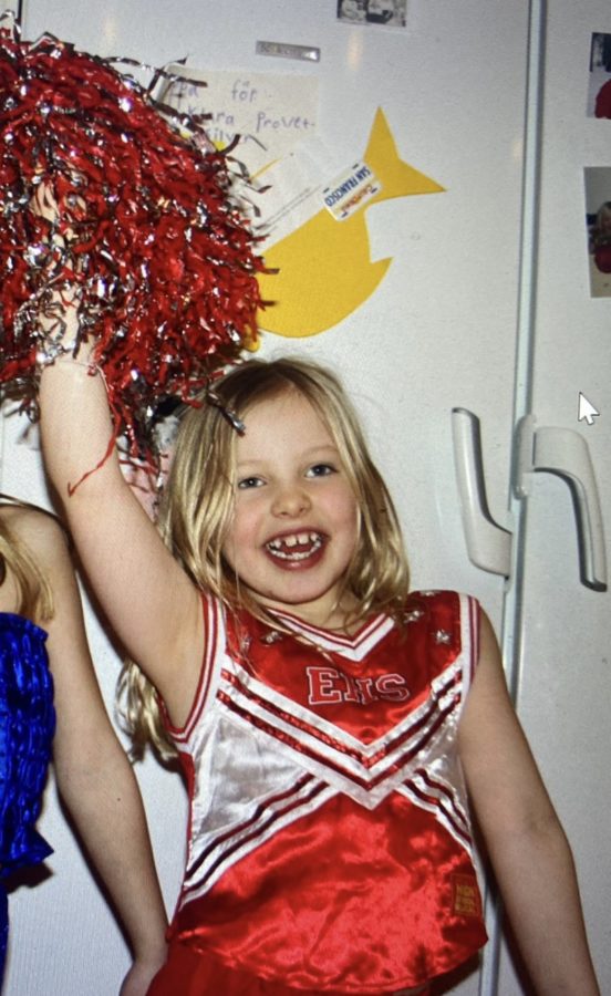 Six-year-old Alex Svärd shakes a pom pom in her “High School Musical” cheerleading outfit. She enjoyed playing dress up and singing the “High School Musical” soundtrack. 