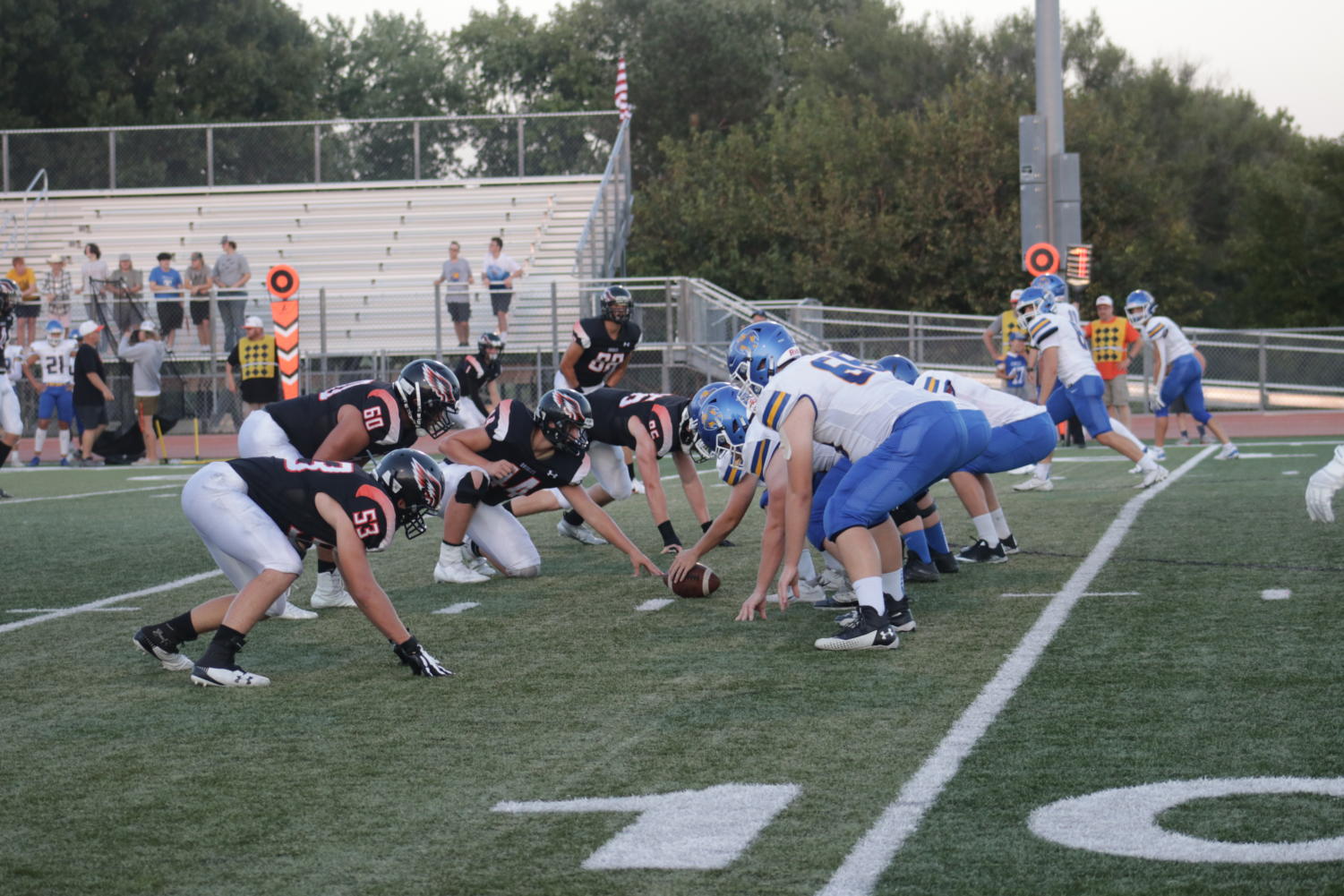 The players are all lined up ready for the quarterback to snap the ball at the home football game between Augusta and Circle. The game ended with Circle winning with a score of 42 - 35.