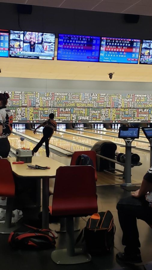 Junior Dustin Scott finishes bowling his 9th frame. This was Scott’s first year on the bowling team. 