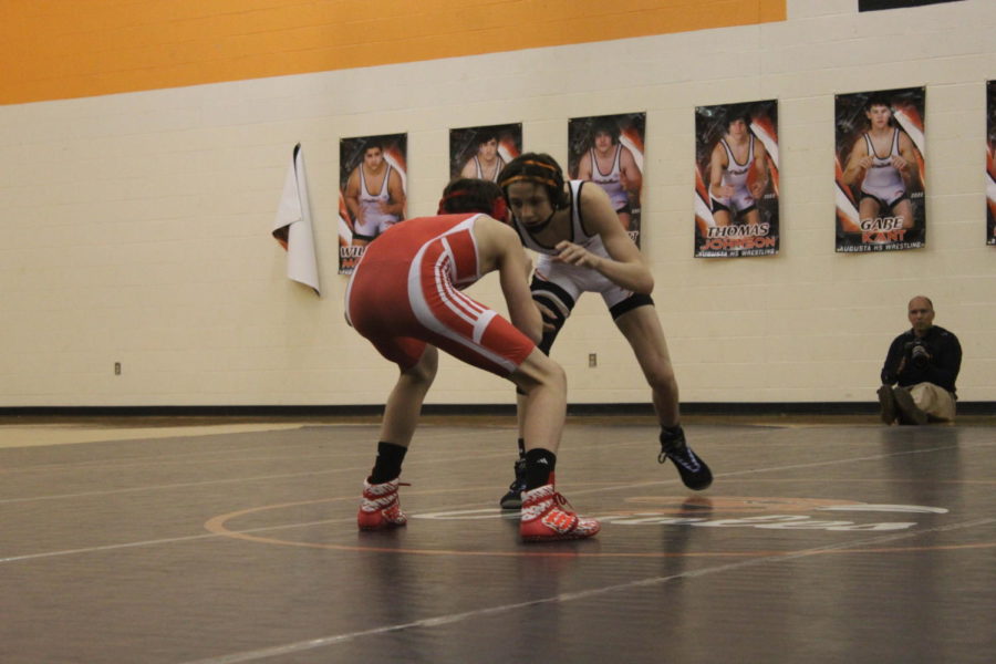 Junior Kalvin LaPlant looks to make a moce so he can take down his Winfeild opponent. The  Oriole wrestlers won the duel  78 to 6.