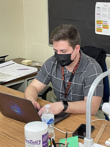 Art teacher Adam Kroeker searches for new lesson plans. Kroeker joined staff at semester and is adjusting to his position. 