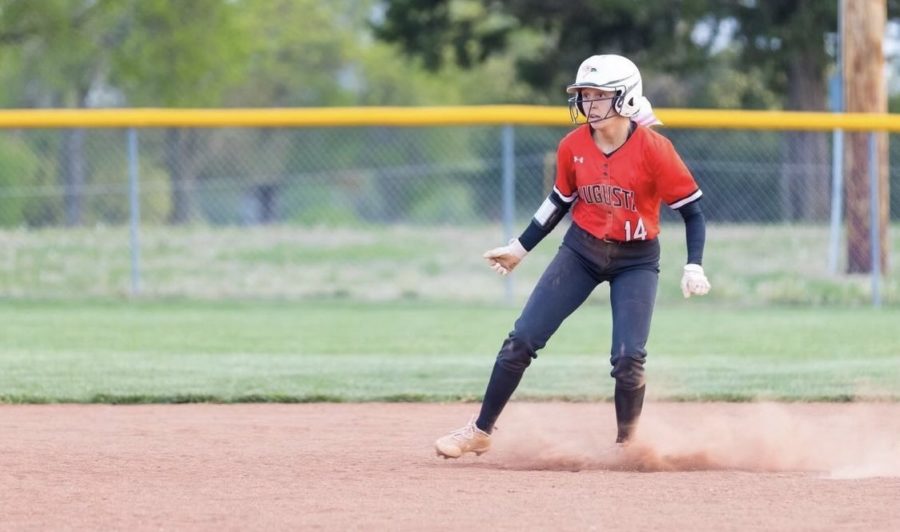 Riley+watches+a+play+develop+as+she+decides+to+stay+third+base+or+make+the+move+home+run+and+score+another+point+for+Augusta.+She+has+enjoyed+her+season+with+her+best+friend+junior+Kennadi+Poore+on+the+team+with+her.+
