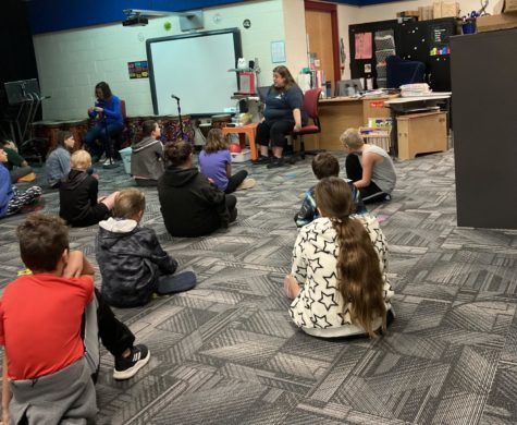 Music teacher Megan Hilton instructing her fifth grade music class through the fourth and fifth grade music concert. Junior Alex Evans job shadowed Hilton at Garfield Elementary for his job shadow portion of the junior project.
