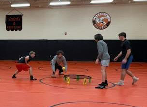 Junior wrestlers Austin Duncan, Weston Bratton, Kalvin LaPlant and Roman Coldwell play Spike Ball while waiting for wrestling practice. Wrestlers next meet is Jan. 5 at Abilene High School for both girls and boys.