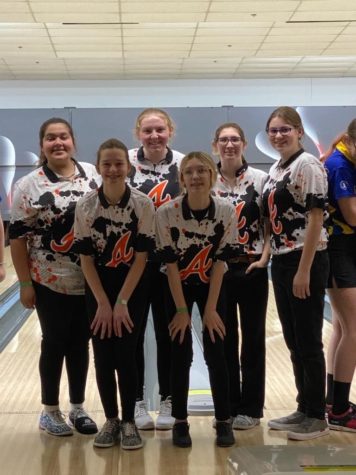 The girl’s bowling team poses for a picture. Before the photo was taken all of the teams were called up. 