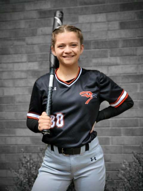 Sophomore Megan Ashenfelter in her new softball uniform, including the pants her family provided for her. Ashenfelter’s parents spent over $90 trying to purchase the pants that matched her teammates.
