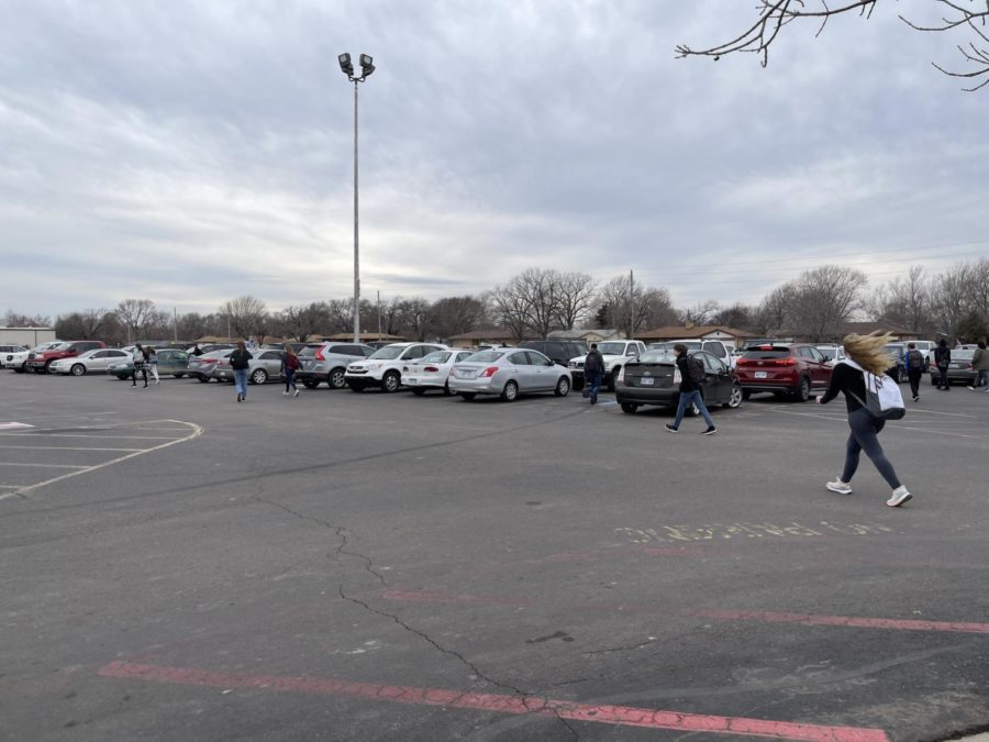 Students walking to their vehicles after school. Many students park their cars here everyday.