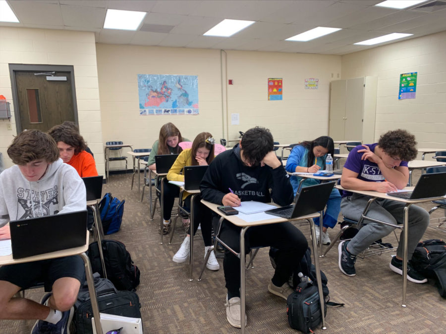 Students working in Morgans college algebra class. Students have to manage their time between college classes and regular courses.