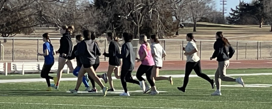 On the field in Hiller stadium members of the girls soccer team participated in various running activities for warm ups during conditioning practice on Feb. 1.  Girls soccer tryouts will be held Feb. 27-28. 