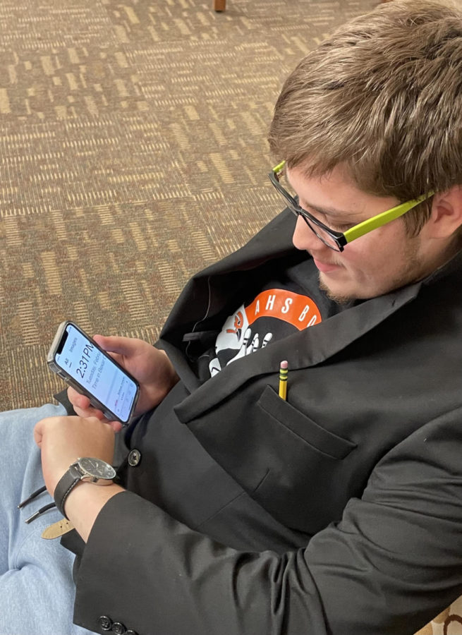 Senior Jacob Humphrey looks at both analog and digital clocks to see if he got the time right. Humphrey prefers analog clocks because it makes his mind think more. 