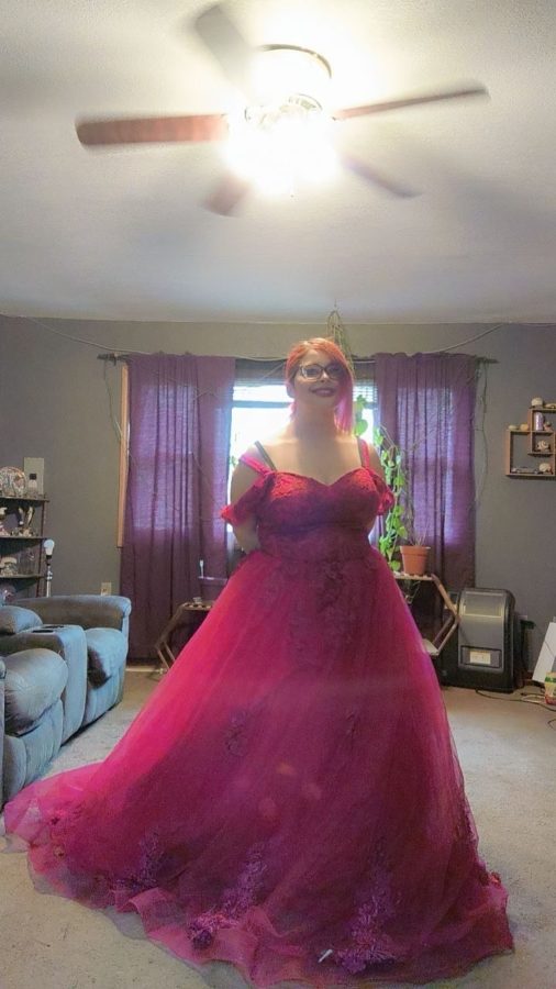 Senior Halo Lawson wears the dress she picked out from the Fluff Your Feathers dress exchange. Lawson decided to use the program for her prom dress so she could save money to participate in a pageant in July. 