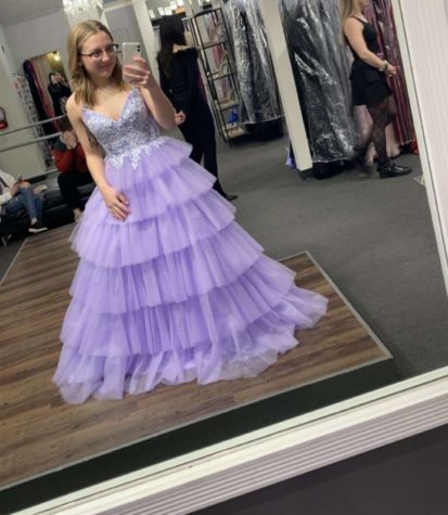 Junior Emma Neuschafer shops for her prom dress in Wichita. She purchased her dress from Dress Gallery. After seeing a tiered dress on TikTok, Neuschafer fell in love with the style. 