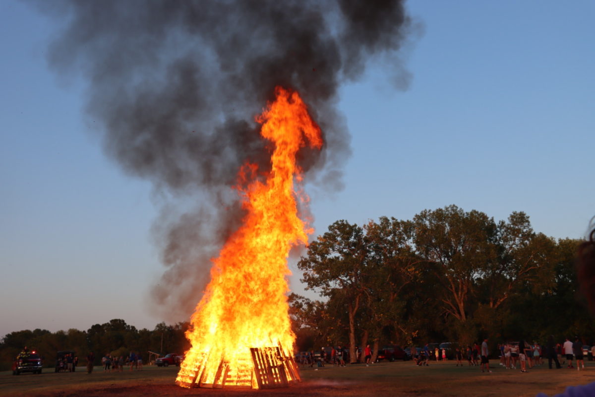 The Booster Club hosts the bonfire at the Augusta Lake. The bonfire is a way for the community to come together and support the athletic teams for their upcoming seasons.