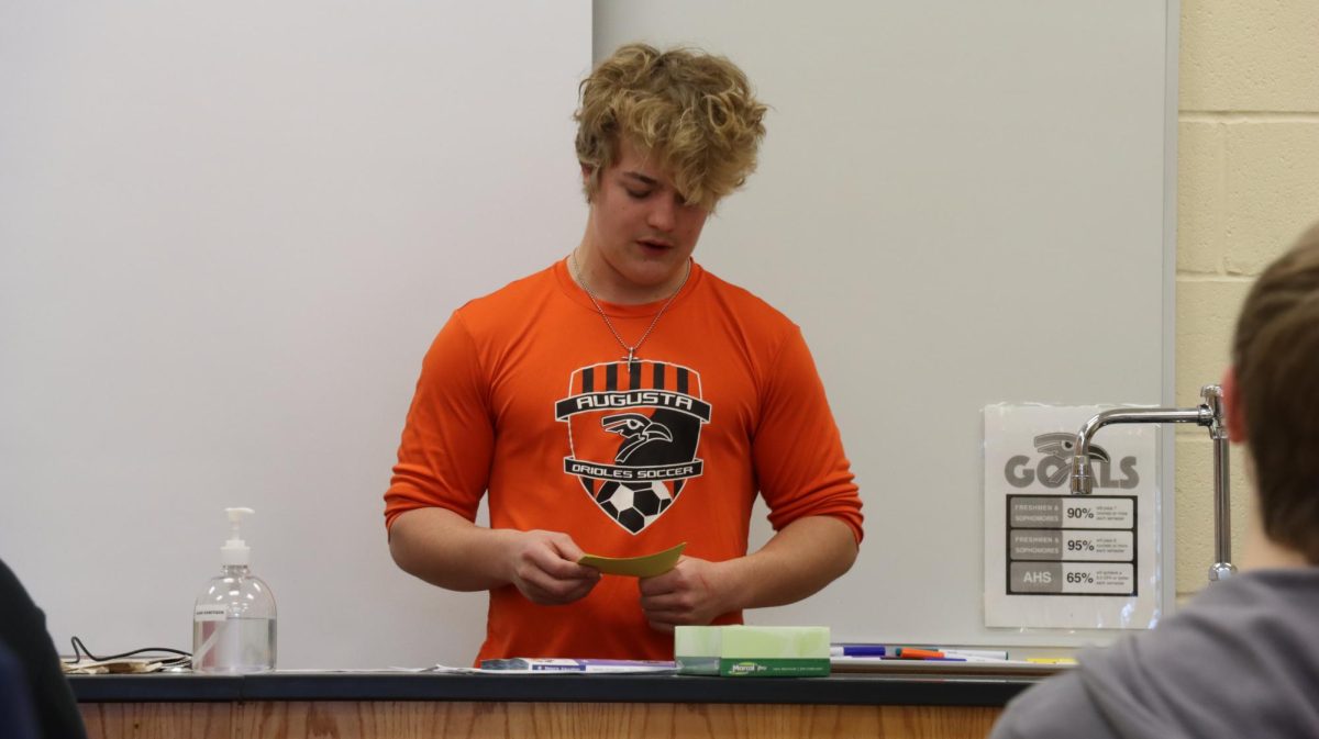 Junior Dalton Pankratz gives his testimony at a Fellowship of Christian Athletes meeting Dec 7. He was anxious and used a notecard to help him but ended up enjoying the experience. 
