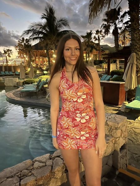 Junior Maeve Fleming stands smiling at the resort she stayed in at Cabo, Mexico. She enjoyed her time at the resort, and was very grateful to be invited on the trip. “I got invited by my best friend and her family,” Fleming said.
