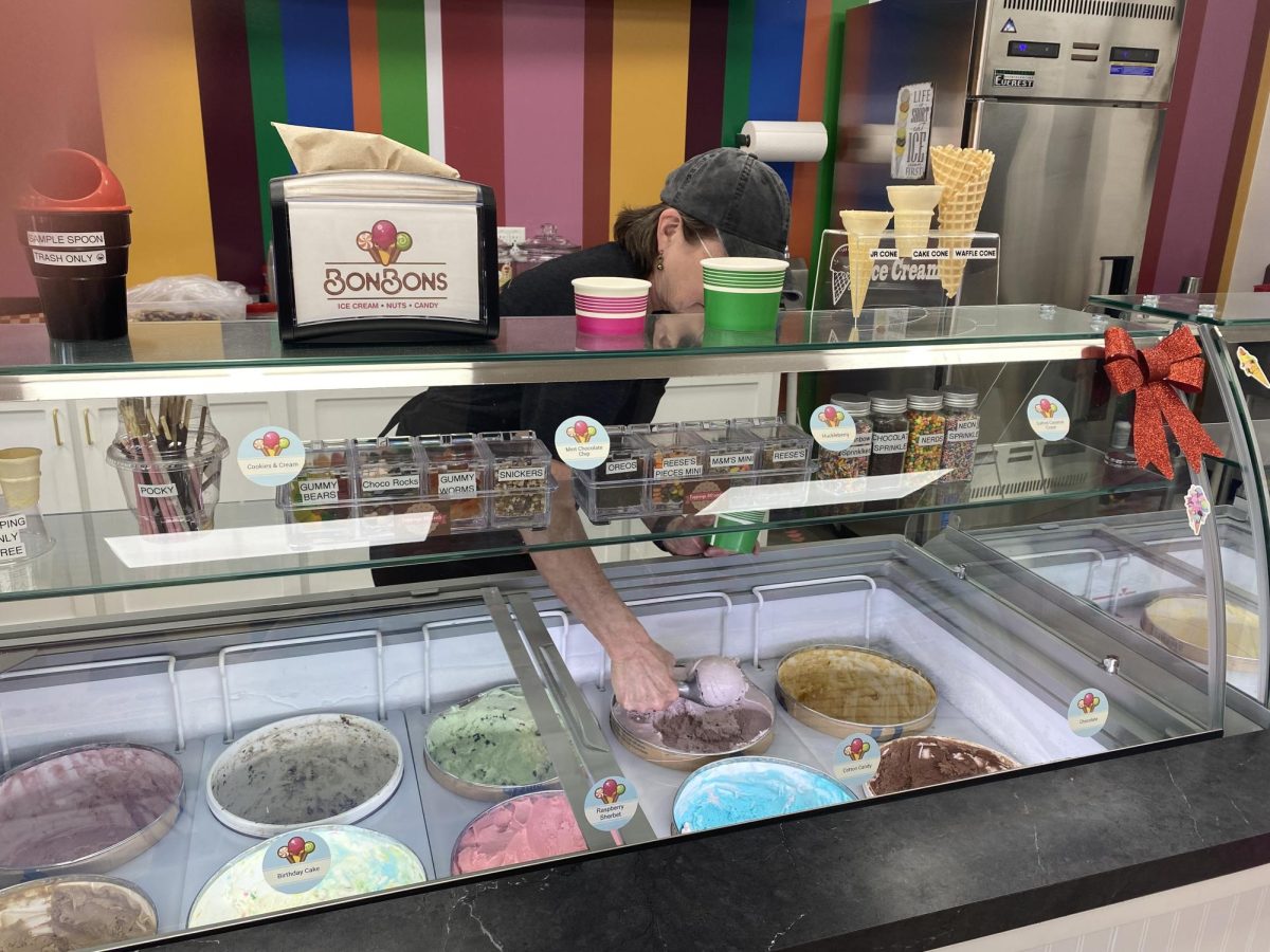 BonBons+owner+Cory+Patterson+scoops+ice+cream+for+a+customer.+BonBons+is+open+Monday+through+Saturday%2C+they+are+closed+on+Sunday.