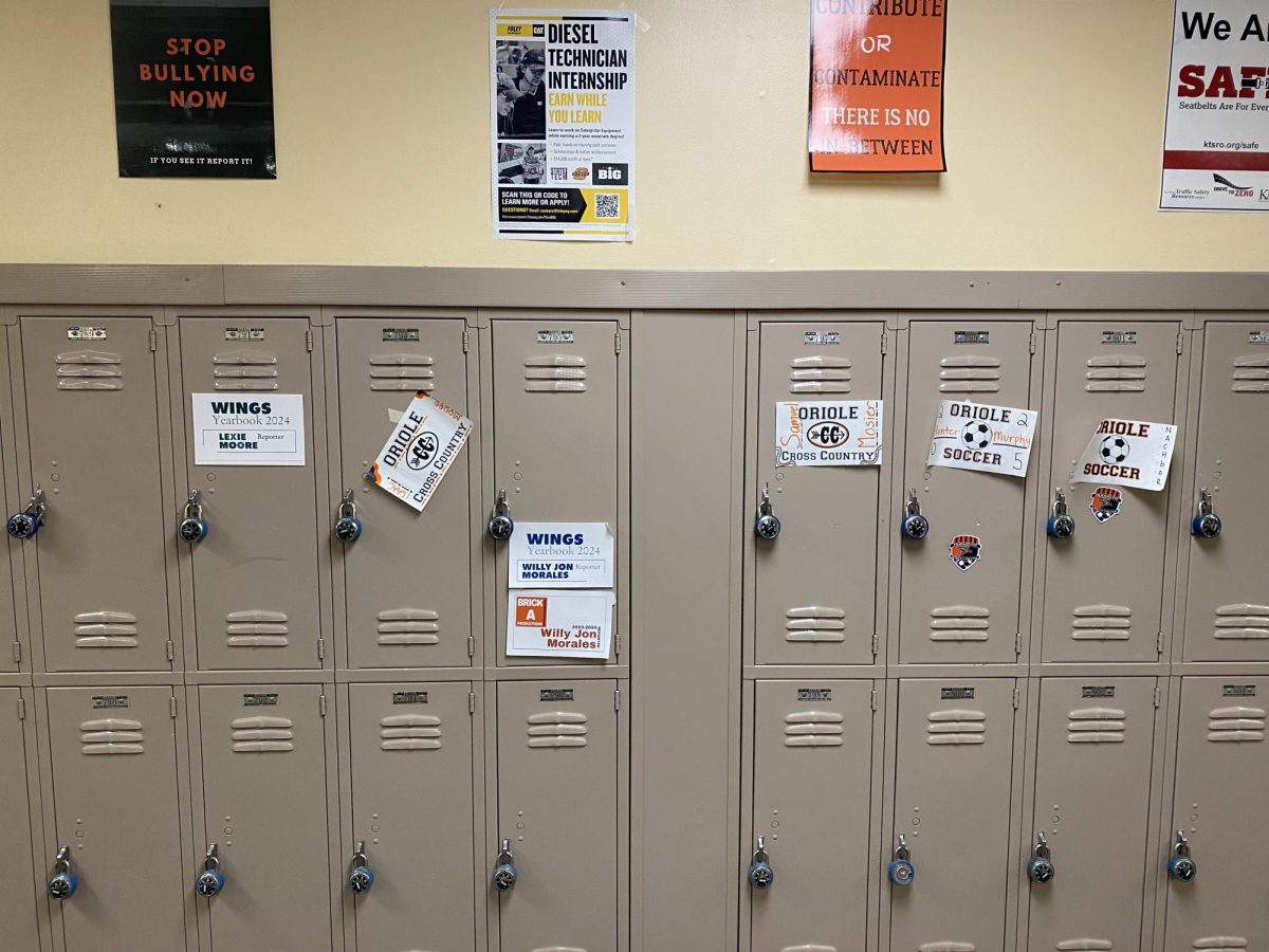 Locker+signs+decorate+junior+lockers.+Editors+or+the+adviser+design+the+journalism+signs%3B+cheerleaders+make+the+posters+during+their+lock-in+and+fall+sports+locker+signs+during+ACE+or+whenever+time+allows.+
