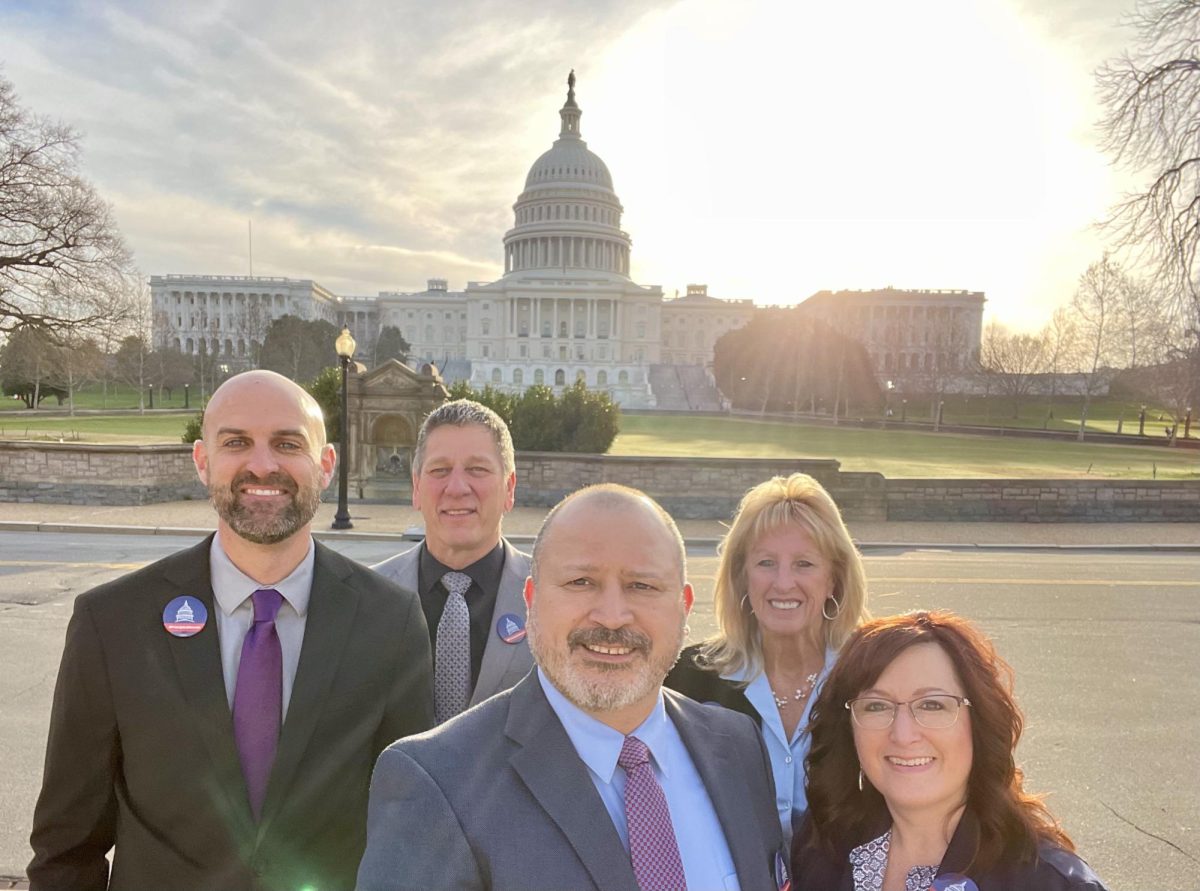 Clifton-Clyde Middle School Principal Eric Sacco, Washington Elementary School Principal John Benfort, Principal Rick Rivera, Kansas Principals Association Executive Director Cara Ledy and Andover Central Middle School Principal Leslianne Craft take a picture in front of the Capitol Building during Capitol Hill Day. The principals and executive director met with legislators, representatives and other principals to discuss and advocate for a variety of legislative bills affecting schools, students, teachers and education.