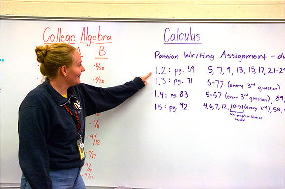 Math teacher Cammi Cosby points to her Calculus class’s homework. Prior to becoming a full time teacher she was a substitute teacher for the second semester of the 2023-2024 school year.