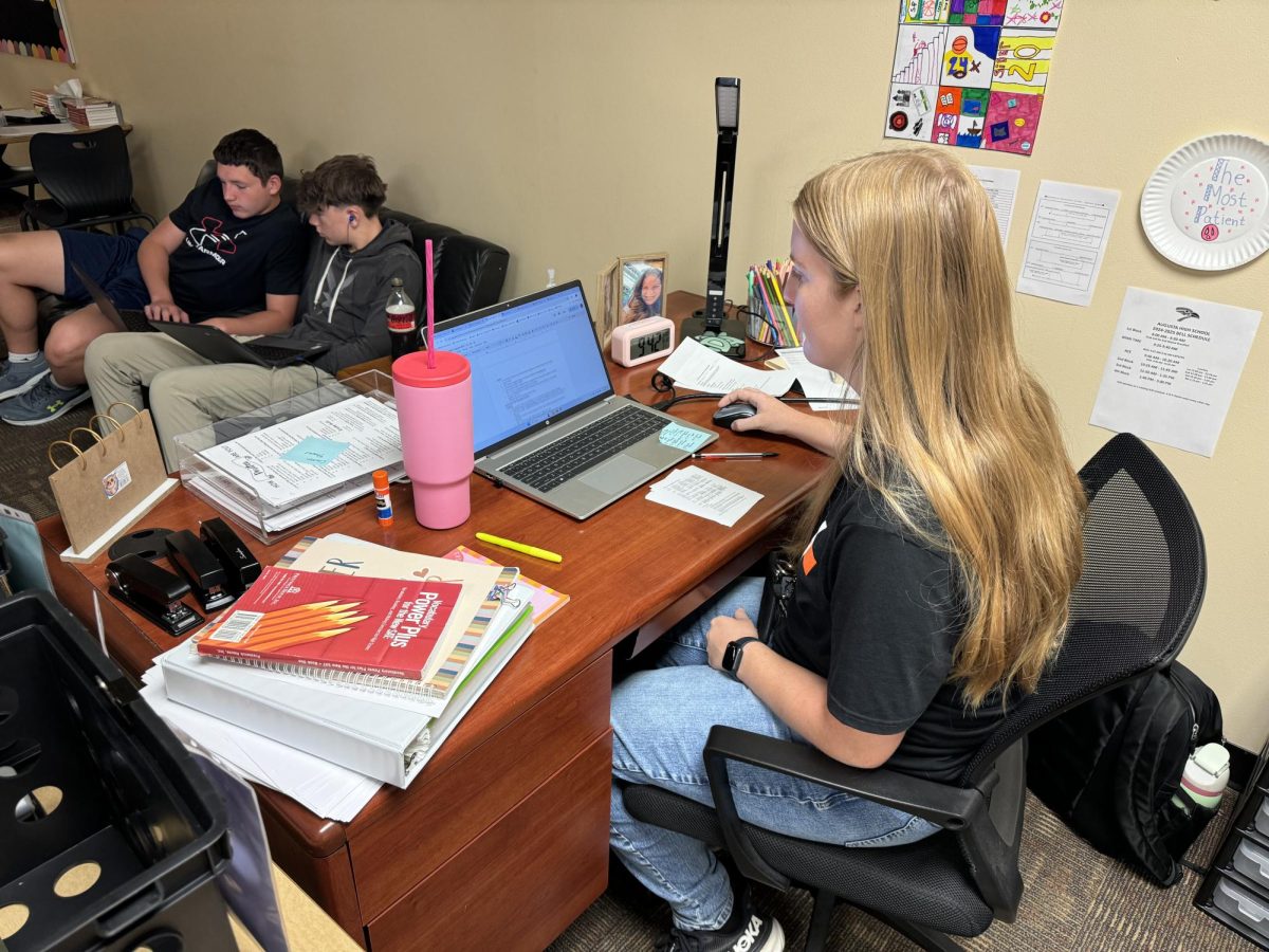 English teacher Austyn Suddeth works on grading her students’ homework. She enjoys reading as well as hanging out with her family and friends.