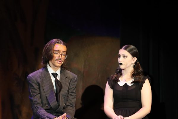 Junior Gibson McNutt as Gomez Addams and Senior Kyndall Dodds as Wednesday Addams reminisce on Wednesday's childhood which leads into the song "Happy Sad"