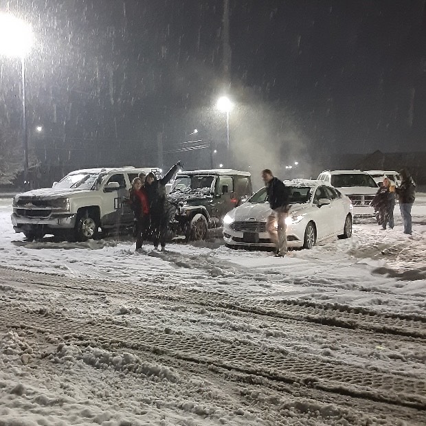 At the El Dorado YMCA junior Baylee Ohl, some of her co-workers and their parents enjoy the second snow storm of the year. Ohl was released from work due to weather conditions on Jan. 9. Three co-workers helped clear snow off their cars making for a memorable experience.  