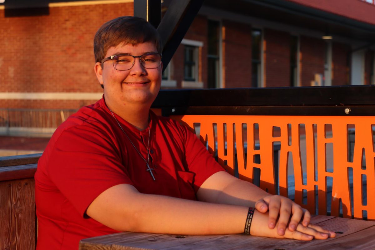 Senior Logan Hicks poses for his senior pictures at downtown Augusta on October 13, 2024. Hicks paid for dinner at Candles Mexican Restaurant after the photo shoot. 