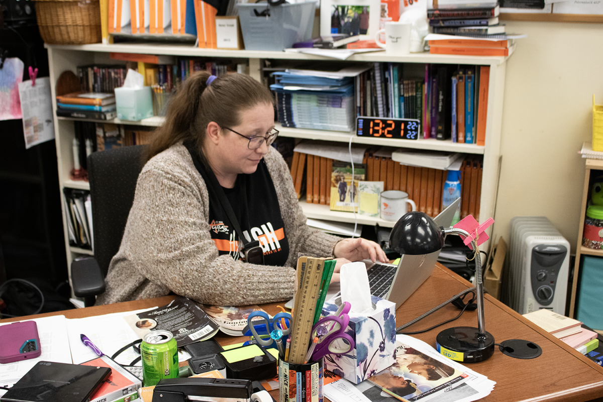 English teacher Kristiana Smeltzer writes a lesson plan for her upcoming classes in room 305. To compensate for snow days, Smeltzer combines grammar and vocabulary assignments to allow students more class time.