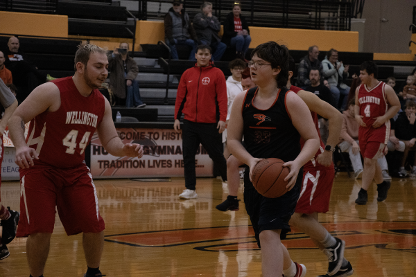 Jacob young driving down the court while Eisenhower try and stop him.