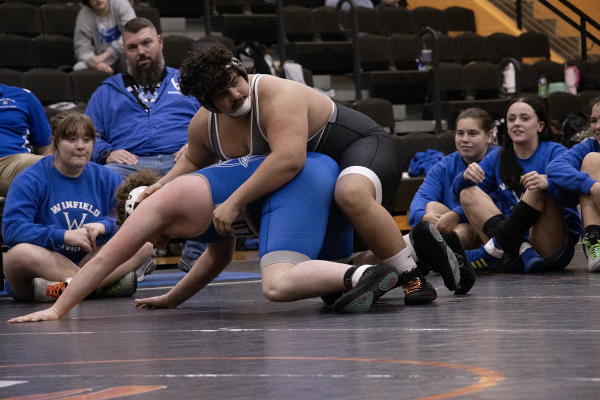 
Senior Willy Jon Morales competes in a duel wearing his surgeon-issued brace. State tournaments take place Friday 28 and March 1.