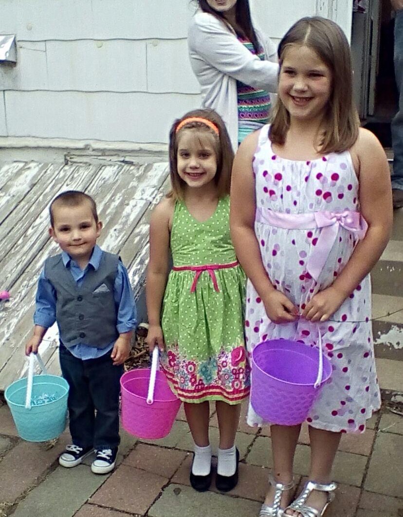 Younger cousin Wyatt Russell, Abigail Brinkley and Emily Brinkley get ready to look for eggs on easter morning with their younger cousin Wyatt Russell. They all enjoy getting up early to see what the easter bunny brought for them.