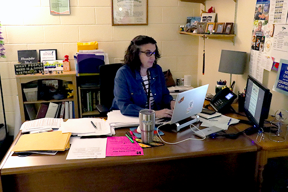 Counselor Audrey Neushafer sits at her desk managing next year's schedules. Neushafer is the sophomore and senior counselor, she is also responsible for a large portion of student future planning.